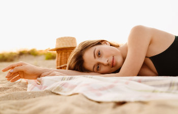 calm woman lying on the beach, 
